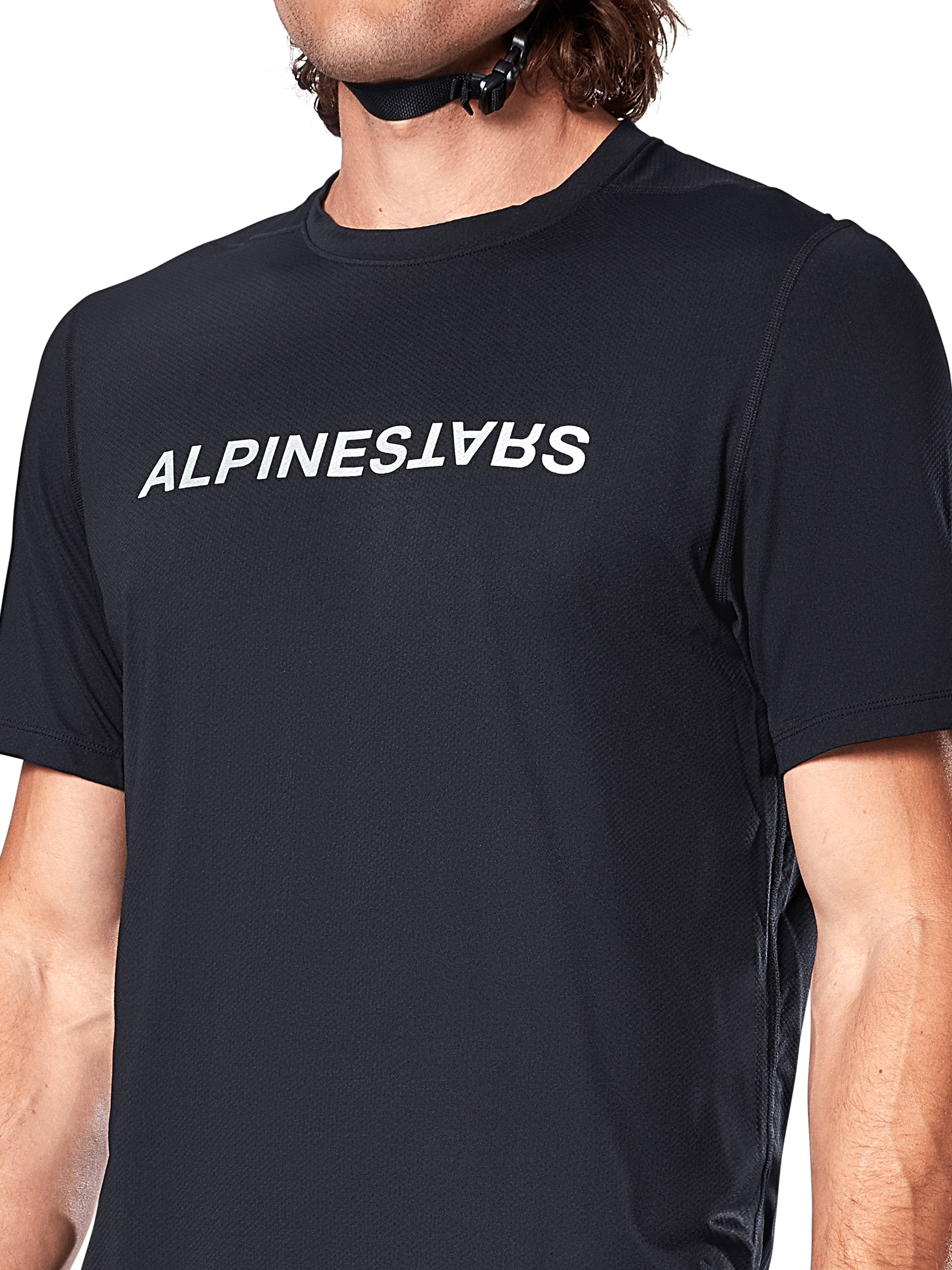 Alpinestars A-Dura Switch Short Sleeve Jersey, Black, featuring a large white wordmark logo screen-printed on the chest, performance jacquard fabric texture, close-up front view