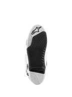 Alpinestars Tech 10 Stiefel, Motocross-Stiefel, Weiß und Schwarz, Unteransicht der Sohle mit strukturiertem Griffmuster, Alpinestars-Logo und austauschbarem zentralem Einsatz für den Offroad-Rennsport.