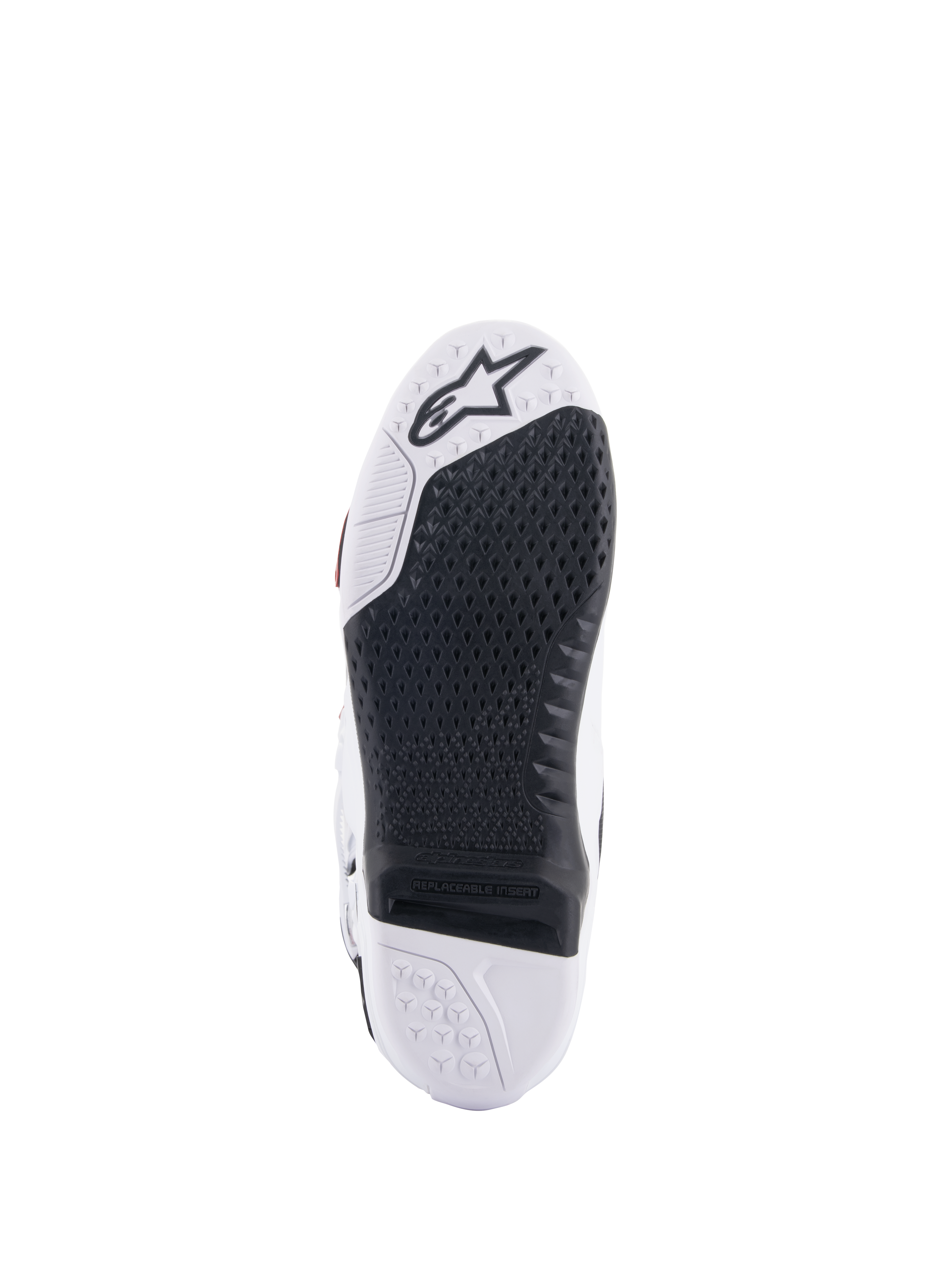 Alpinestars Tech 10 Supervented Stiefel, Sohlenansicht in Weiß und Schwarz, mit erweitertem Waben-Grip-Design, schwarzem austauschbarem Mitteleinsatz, weißem Zehenbereich mit Alpinestars Stern-Logo, optimiert für Motocross-Fußrastenkontrolle