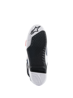 Alpinestars Tech 10 Supervented Stiefelsohle, Unteransicht mit schwarz-weißem Dual-Compound-Design, Wabenstruktur für Grip, austauschbarem zentralem Einsatz und geprägtem Alpinestars-Logo, optimiert für Motocross-Fußrasten-Performance.