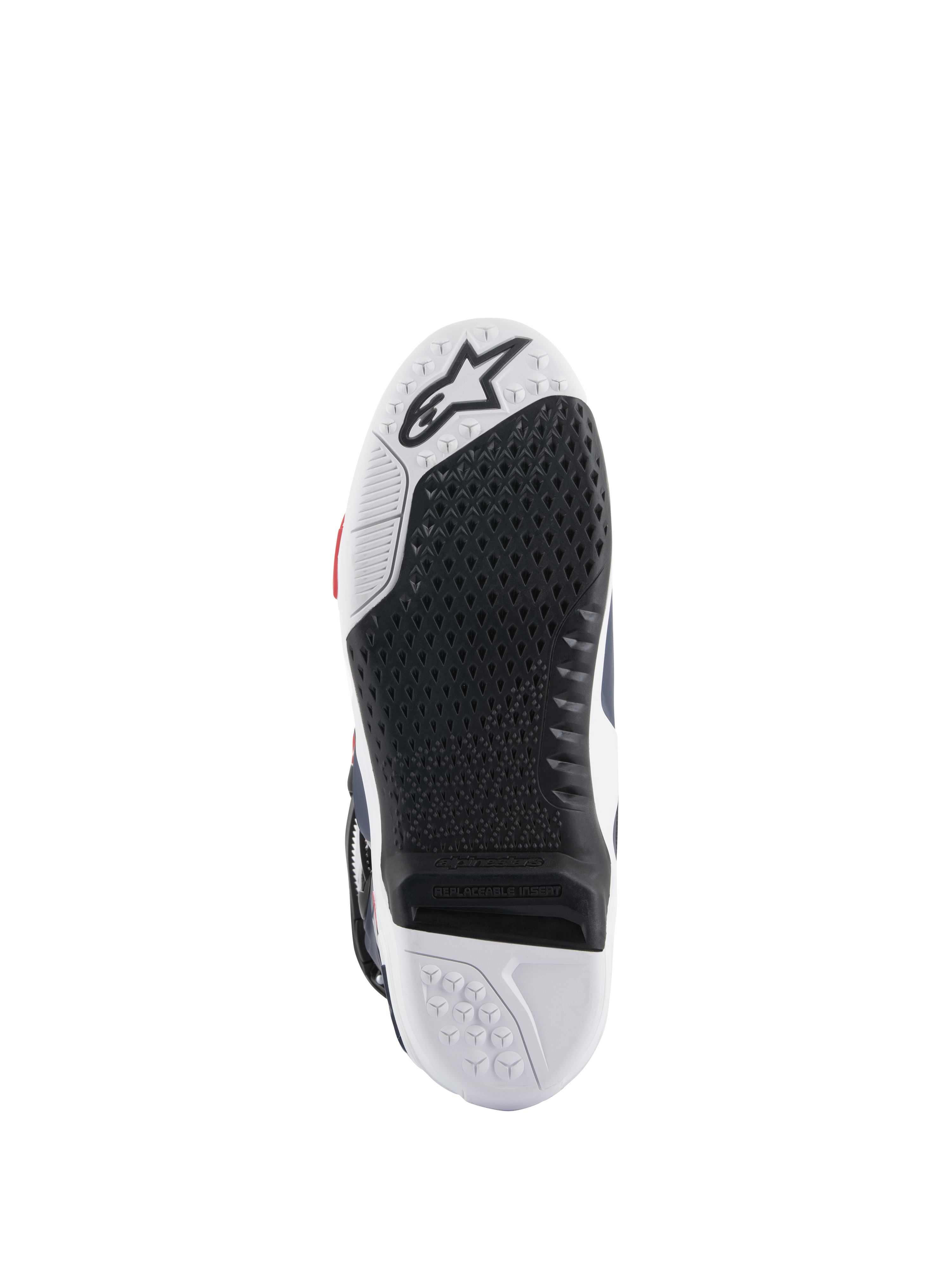 Alpinestars Tech 10 Supervented Stiefelsohle, Unteransicht mit schwarz-weißem Dual-Compound-Design, Wabenstruktur für Grip, austauschbarem zentralem Einsatz und geprägtem Alpinestars-Logo, optimiert für Motocross-Fußrasten-Performance.