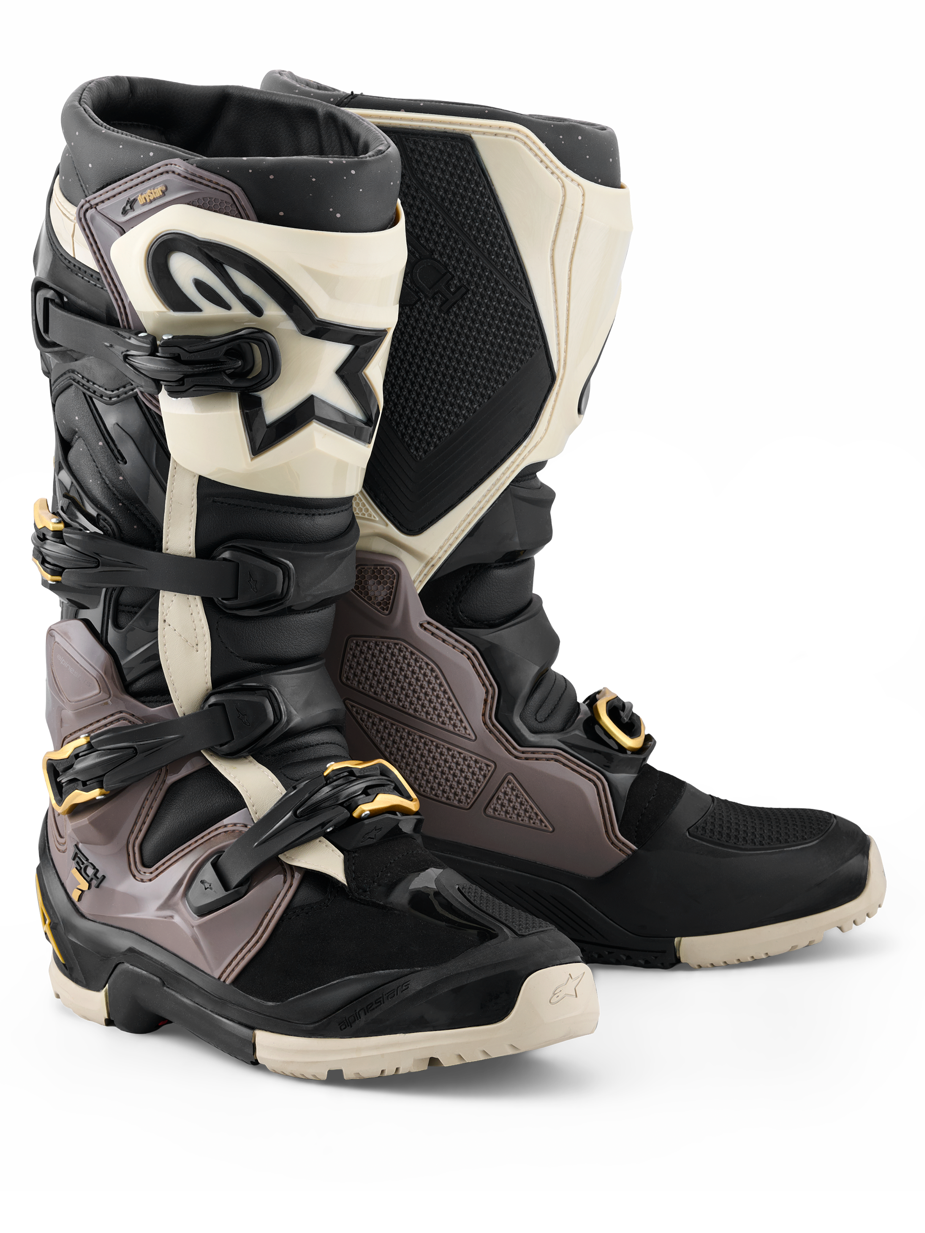 Alpinestars 2026 Tech 7 Enduro Drystar® Boots, Motocross and Enduro Boots, Black Dark Gray and Gold, featuring a rugged TPU shell, quick-release aluminum buckles with gold accents, and a large white shin plate with a black logo, designed for off-road durability.