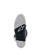 Alpinestars Tech 7 Boots sole view, Motocross Boots, Light Gray and Black, featuring a dual-compound vulcanized rubber sole with a white Alpinestars logo, red wear limit indicator, and high-traction textured grip pattern.