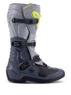 Alpinestars Tech 3 Stiefel, Motocross-Stiefel, Dunkelgrau, Hellgrau und Schwarz, Seitenansicht mit drei schwarzen Polymerschnallen, TPU-Schutzpaneelen und einem leuchtend gelben Alpinestars-Logo im oberen Schienbeinbereich