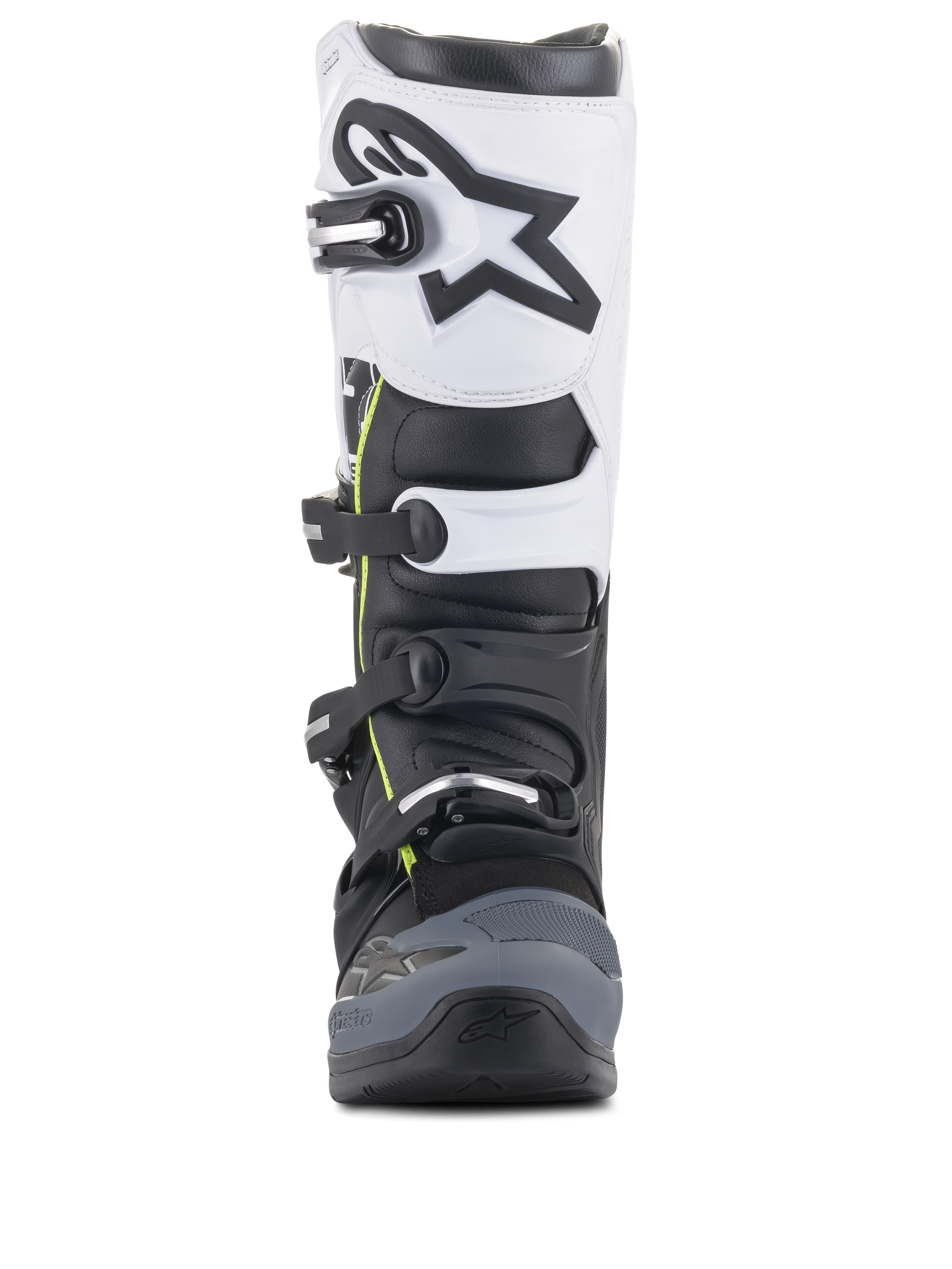 Alpinestars Tech 5 Stiefel, Motocross-Stiefel, Schwarz, Dunkelgrau und Weiß, Vorderansicht mit einem Multi-Schnallen-Verschlusssystem, weißes oberes Panel mit schwarzem Astars-Logo, dunkelgrau verstärkter Zehenbereich und dezente gelbe Akzente