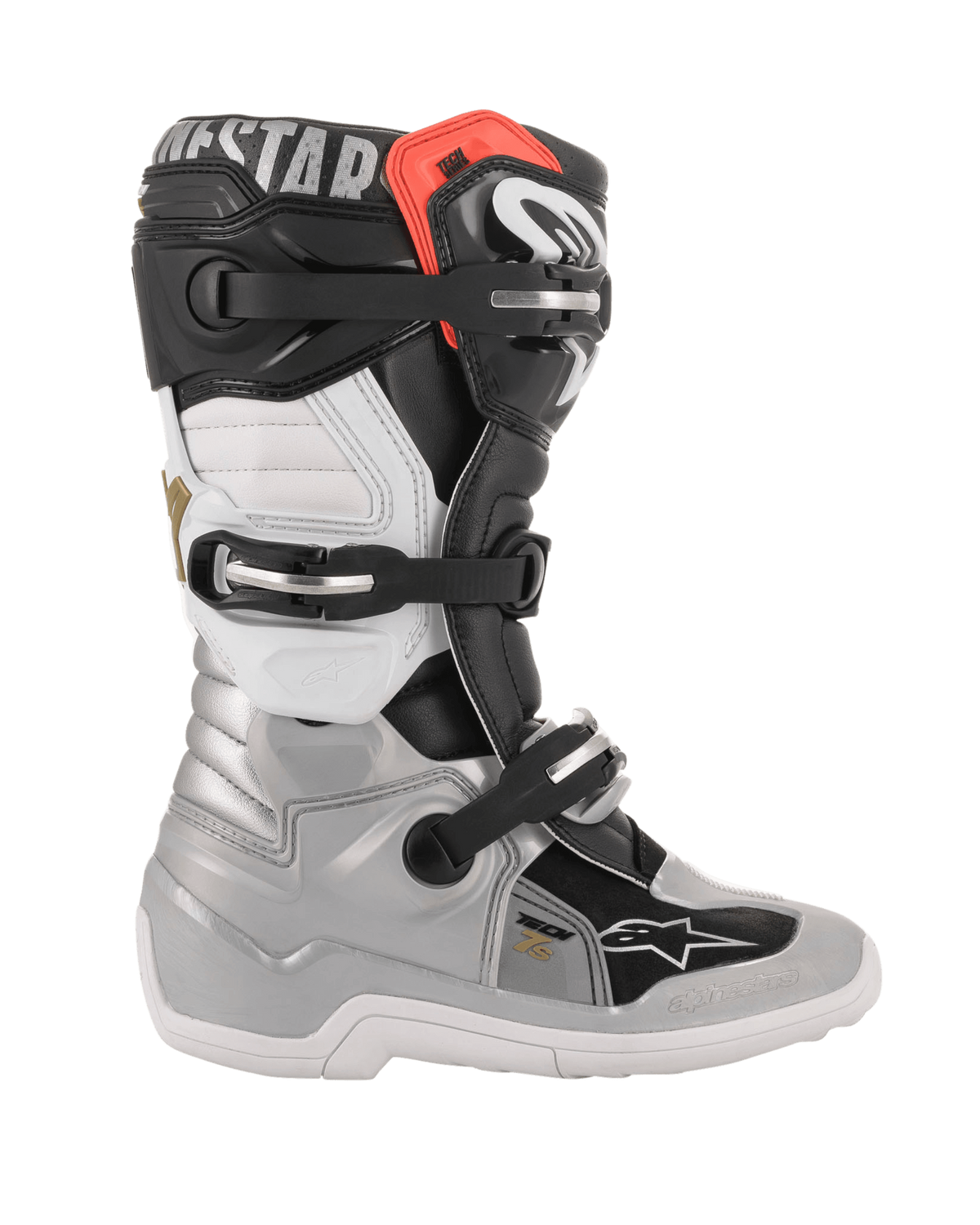 Alpinestars Youth Tech 7S Stiefel, Motocross-Stiefel, Schwarz, Silber, Weiß und Gold, Seitenansicht mit silberner Unterschale, schwarzen und weißen Paneelen am Schaft, rotem Akzent an der oberen Manschette und Drei-Schnallen-Verschlusssystem.