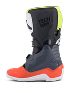 Alpinestars Youth Tech 7S Stiefel, Motocross-Stiefel, Dunkelgrau mit roten und fluoreszierend gelben Akzenten, Seitenansicht, weiße Sohle, 'TECH SERIES'-Branding und langlebige TPU-Schutzpaneele.