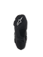 Alpinestars Stella SMX-6 V3 Boots, bottom sole view, black lightweight rubber with textured grip patterns, featuring white Alpinestars logo and embossed branding for traction and pedal control