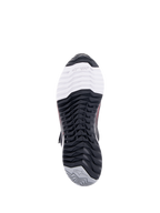 Alpinestars CR-X Damen Drystar® Motorradschuh, Unteransicht der Außensohle, mit TPF Transversal Protection Frame Branding auf weißem Zehenbereich, schwarzem multidirektionalem Profil und grauer Ferse mit Stern-Logo.