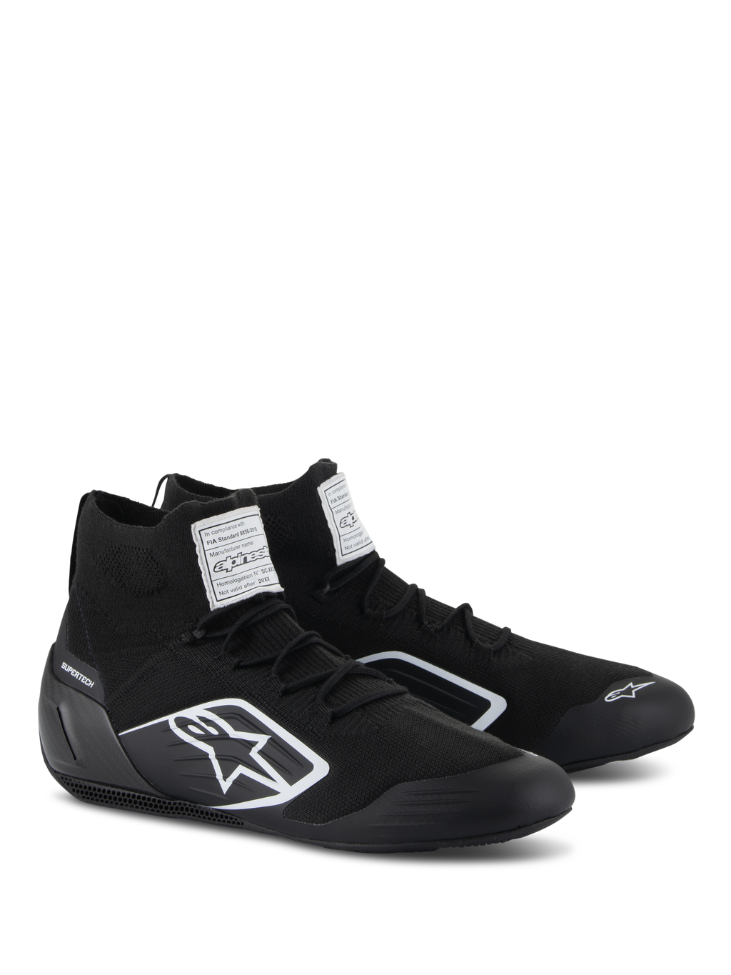 Alpinestars Supertech Shoes, Auto Racing Shoes, Black, featuring a fully knitted fire-retardant upper and carbon fiber heel cup, white Alpinestars logo on the side, FIA/SFI certification labels on the tongue, professional motorsport footwear with a sleek design