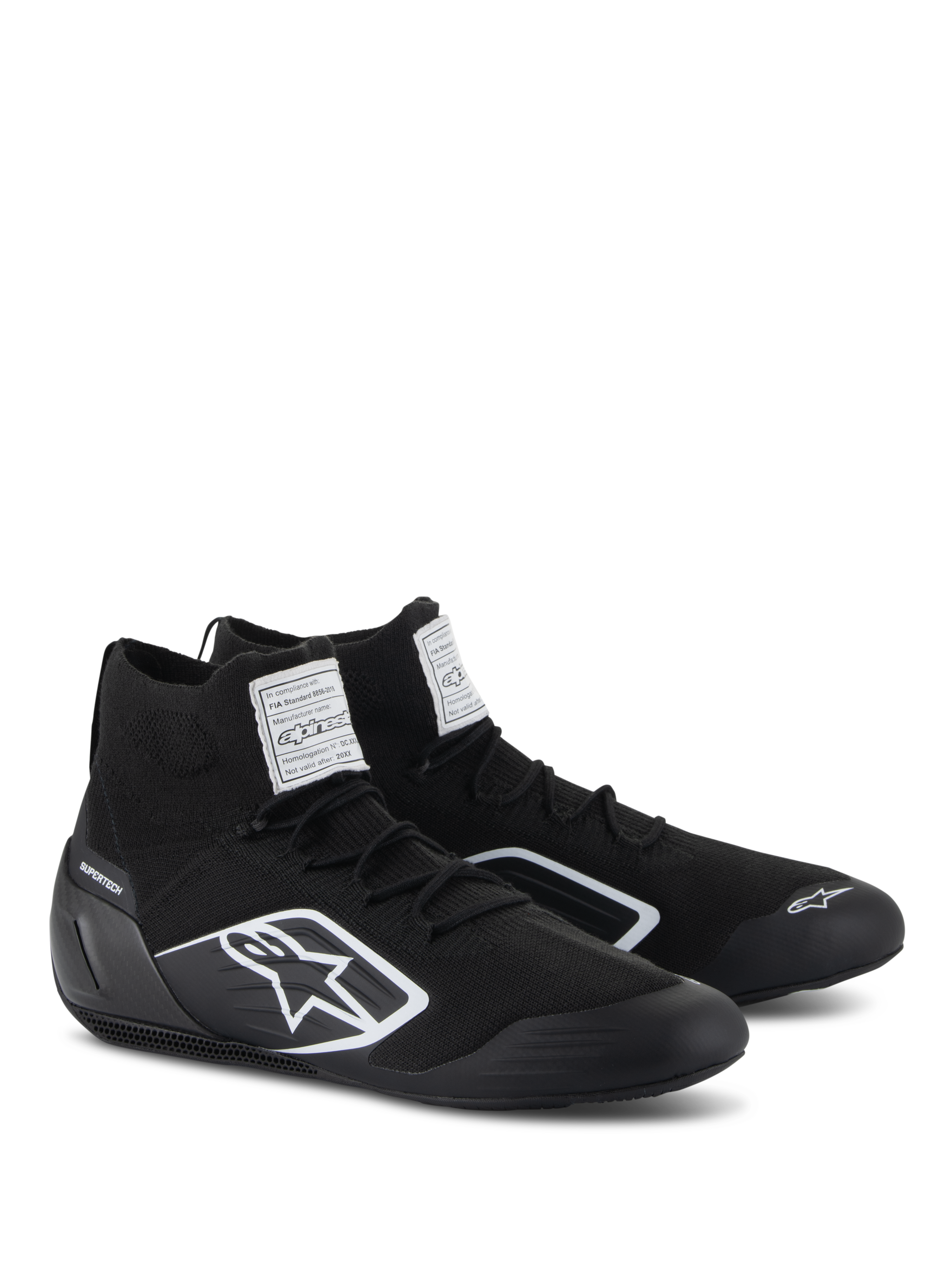 Alpinestars Supertech Shoes, Auto Racing Shoes, Black, featuring a fully knitted fire-retardant upper and carbon fiber heel cup, white Alpinestars logo on the side, FIA/SFI certification labels on the tongue, professional motorsport footwear with a sleek design