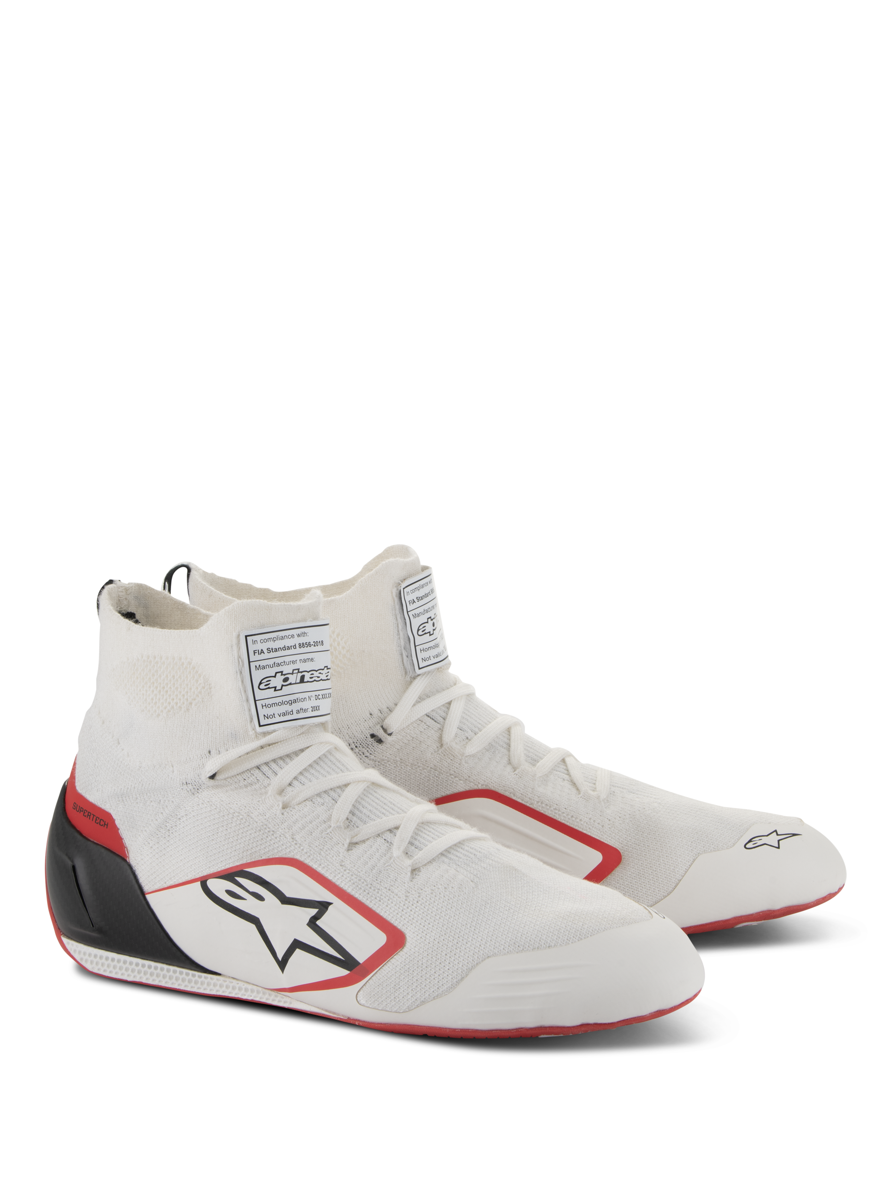 Alpinestars Supertech Shoes, Auto Racing Footwear, White Red and Black, featuring a fully knitted upper, black carbon fiber heel cup, and red accents on the sole and logo, professional motorsport shoes with FIA/SFI certification labels on the tongue.