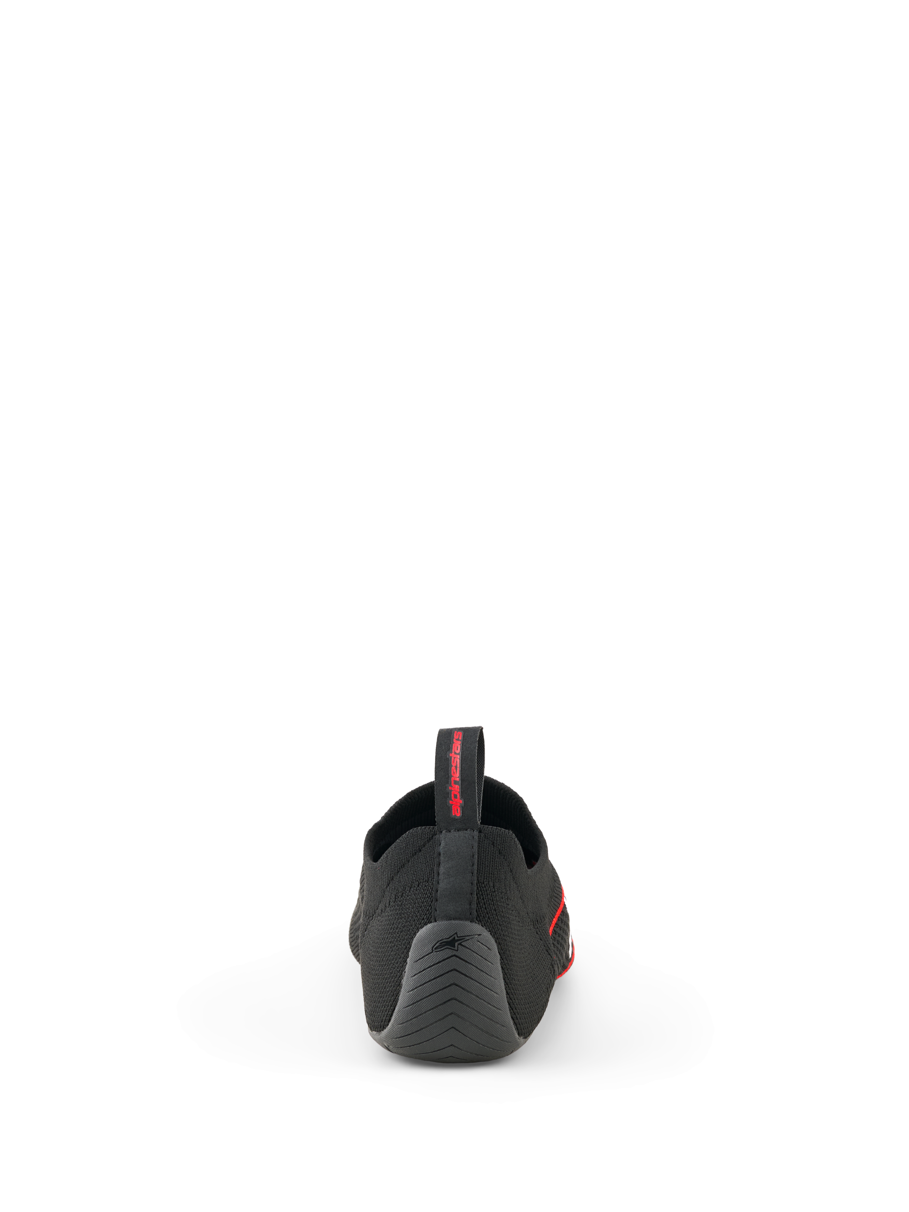 Alpinestars Tech Gaming-Schuhe, Schwarz, Rückansicht mit nahtlosem, gestricktem Obermaterial, strukturierter Gummiferse mit Stern-Logo und hinterer Zuglasche mit rotem Branding, SIM-Racing-Schuhe