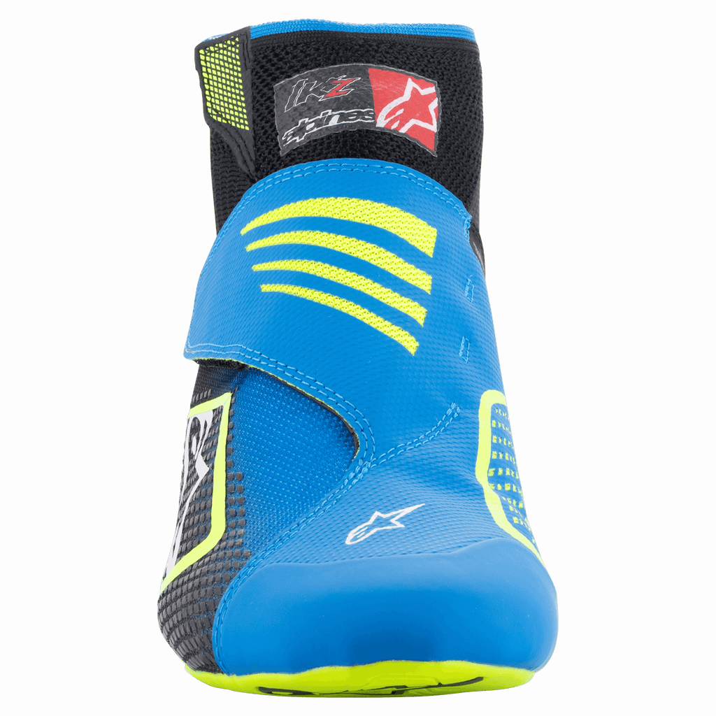 Alpinestars Tech-1 KZ V2 Shoes, Karting Shoes, Black Enamel Blue and Yellow Fluo, front view showing the seamless knitted upper, vibrant blue strap with yellow accents, and black ankle collar.