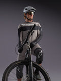 Gray Alpinestars A-Dura Race Long Sleeve Jersey on an MTB rider, featuring black accents and professional cycling gear.
