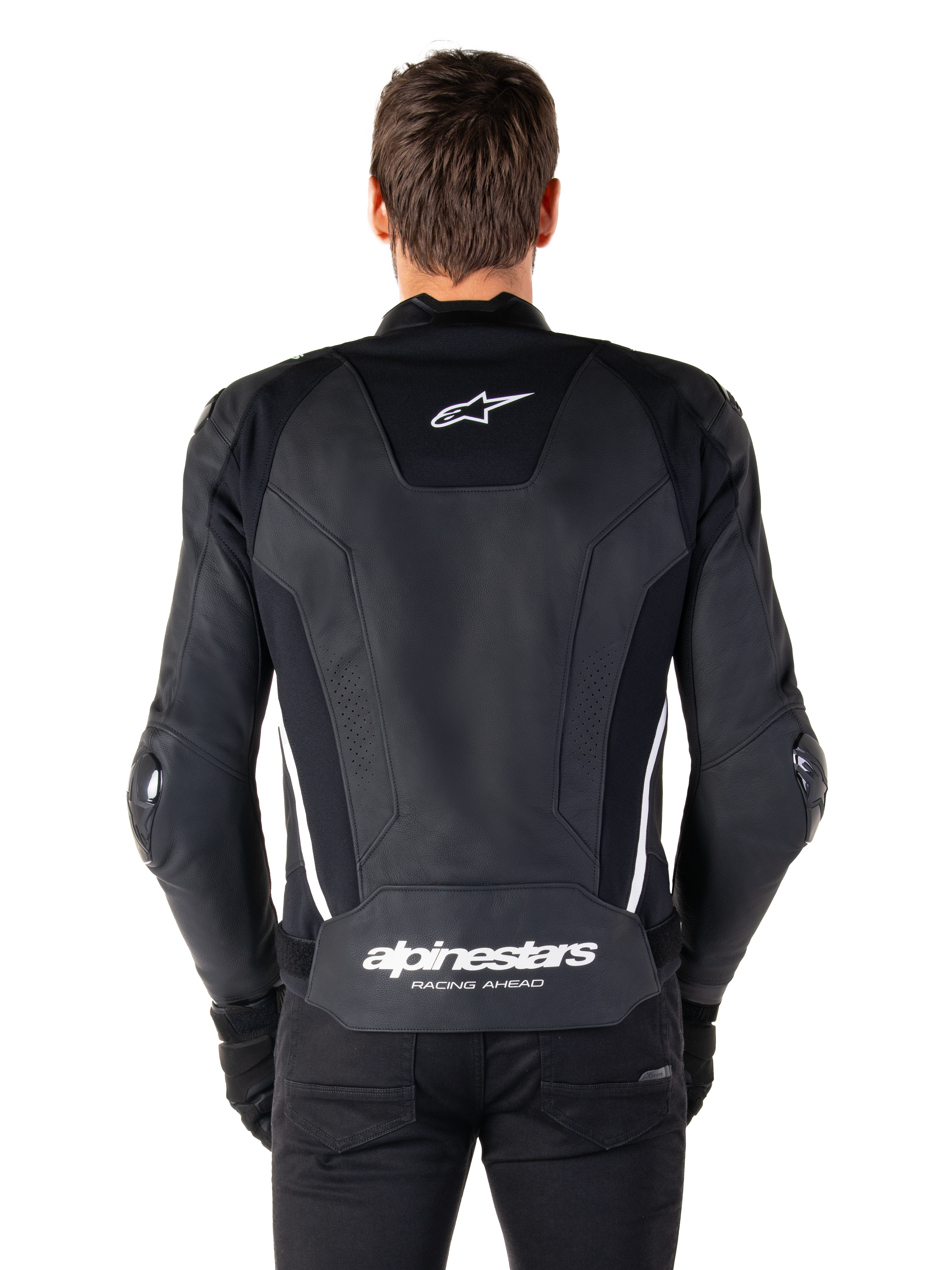 Rückansicht der Alpinestars Missile V3 Lederjacke in Schwarz und Weiß, mit dem Alpinestars-Sternlogo auf dem oberen Rücken und Markenschriftzug im Lendenbereich, weißen vertikalen Streifen und externen Ellbogenschleifern, erstklassige Rennsport-Lederjacke.