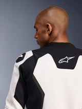Alpinestars GP Force V2 Leather Jacket, Motorcycle Jacket, White and Black, close-up of the upper back and shoulder, featuring the Alpinestars logo and multi-panel leather construction