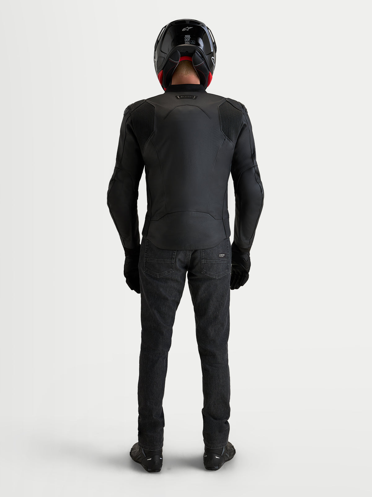 Alpinestars Caliber V2 Leather Jacket, Men's black motorcycle leather jacket, rear view on model showing accordion mobility panels and sport fit construction