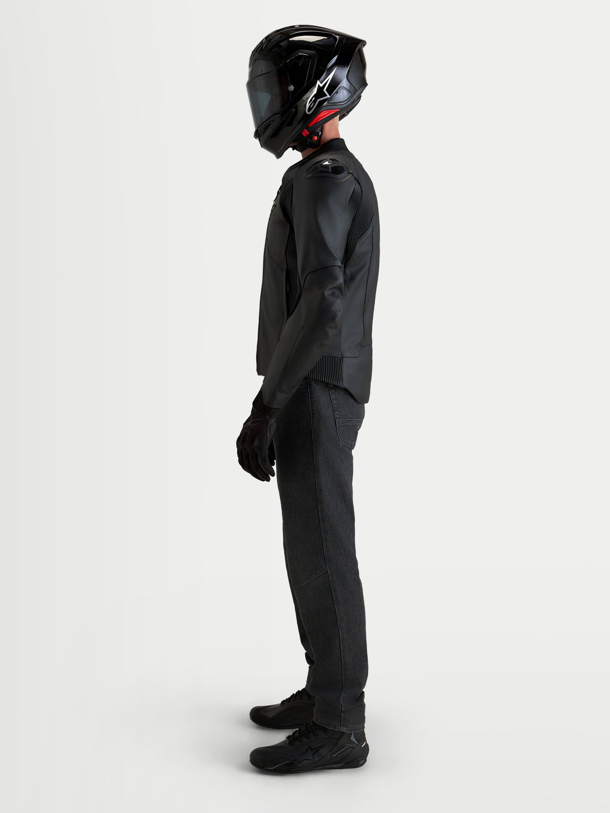 Alpinestars Caliber V2 Leather Jacket, Men's Black motorcycle leather jacket, featuring DFS armor shoulders and CE AA-rated protection, worn by a rider in profile view