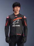 Alpinestars GP Plus R V4 Airflow Leather Jacket in Black with Red Fluo and White accents, worn by a model, featuring perforated leather construction, a large white ASTARS logo on the chest, and integrated shoulder armor for motorcycle racing.