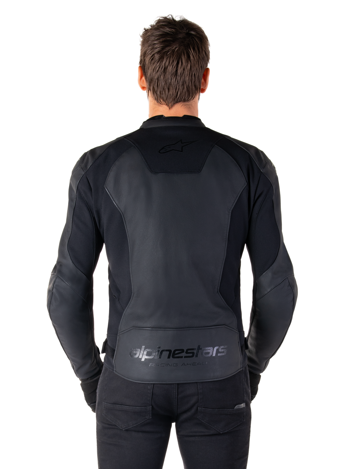 Rear view of a man wearing the Alpinestars Faster V3 Leather Jacket in Black Black, featuring premium leather panels and flexible stretch inserts, subtle 'alpinestars' and 'RACING AHEAD' branding on the lower back, athletic sport fit for motorcycle riding.