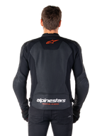 Alpinestars Faster V3 Airflow Leather Jacket, Black, rear view featuring perforated leather panels for ventilation, red Alpinestars star logo, and white branding on the lower back, worn with black pants and gloves.
