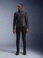 Male model wearing Alpinestars Blacktrack Leather Jacket, Black premium bovine leather, modern minimalist biker design with a tailored fit, paired with black riding pants and boots, urban contemporary style