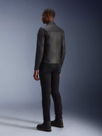Alpinestars Blacktrack Leather Jacket, Black, back view showing tailored fit and leather accordion panels on shoulder blades, worn with black pants and black boots, premium bovine leather motorcycle jacket