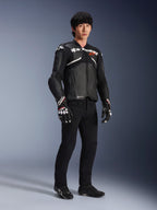 Alpinestars Atem V5 Leather Jacket, Motorcycle Racing Jacket, Black and White, worn with black pants and matching gloves, featuring white Alpinestars branding across the chest and protective shoulder armor.