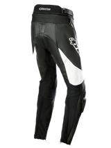 Alpinestars Stella Missile V3 Leather Pants, Women's Motorcycle Racing Pants, Black with white accents, rear three-quarter view showing accordion stretch panels on the lower back, Alpinestars logo on the thigh, and integrated knee sliders for sport riding.