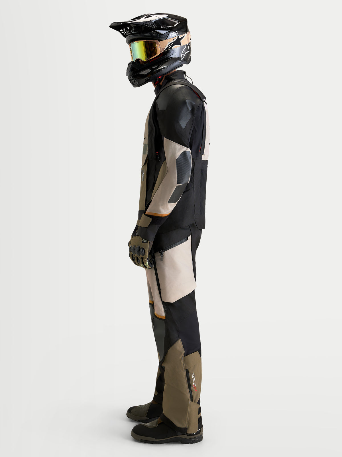 Alpinestars Harok V2 Drystar Jacket, Men's Adventure Motorcycle Jacket in Aluminum, Walnut, and Black, worn by a rider with a matching helmet and off-road gear, side view