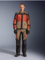 Alpinestars Andes V4 Drystar® Jacket, Adventure Motorcycle Jacket, Walnut Rust Black, worn with matching pants and gloves, multi-tonal design with rust orange and walnut brown panels, durable textile gear for all-terrain riding