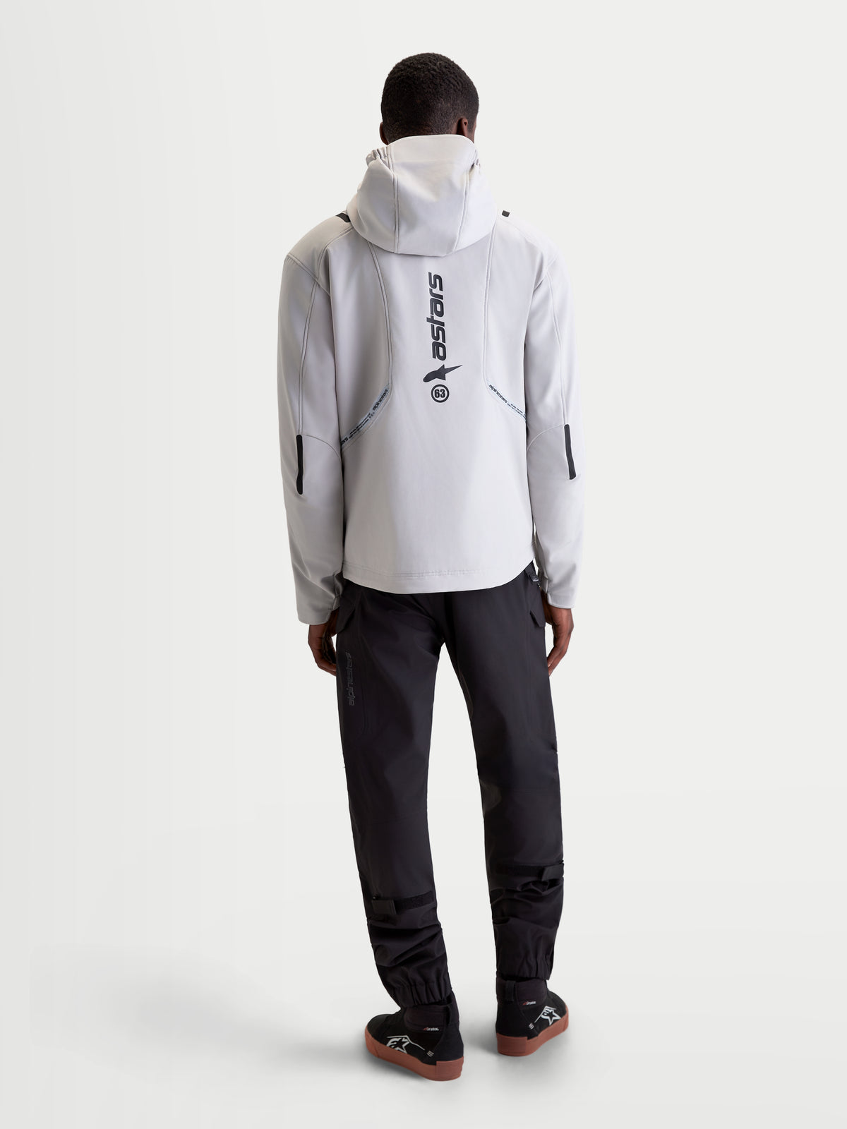 Alpinestars C-5 Drystar Jacket, men's urban contemporary motorcycle textile jacket in light gray and black, rear view showing integrated hood and reflective branding worn by a model.