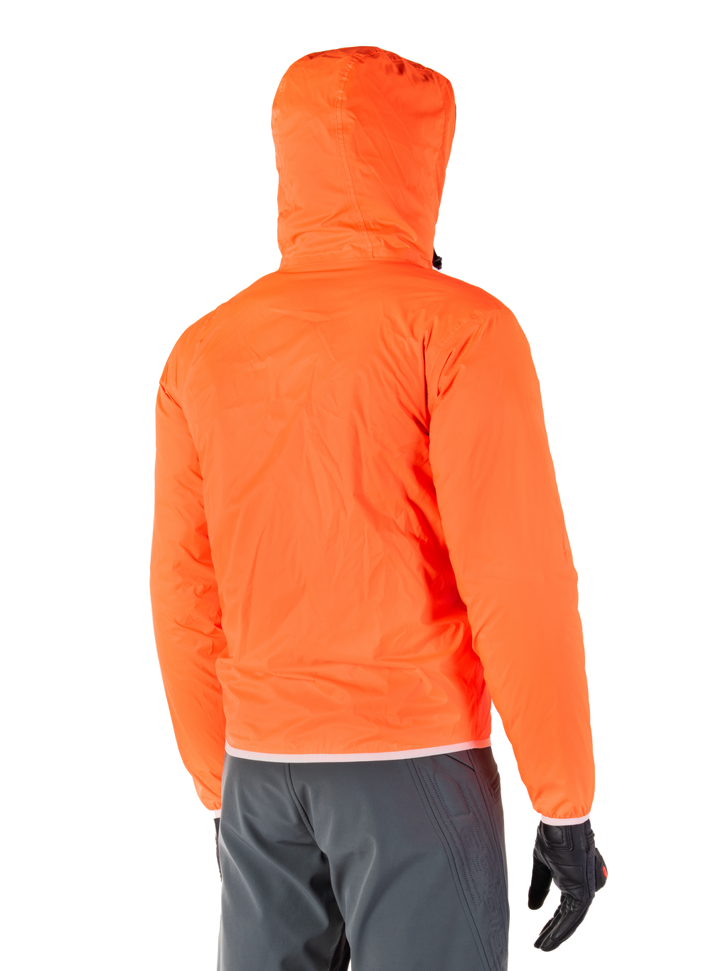 Alpinestars Mohobbs Waterproof Jacket, packable emergency rain liner in bright Orange Fluo, rear view showing stormproof hood, worn with dark grey riding pants and black gloves, lightweight waterproof urban motorcycle gear