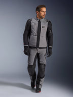 Male model wearing Alpinestars Andes Pro Drystar® XF Jacket in Dark Gray and Black, adventure motorcycle riding suit with matching pants and gloves, featuring a technical textile shell with 'All Terra' branding, complete gear for long-distance adventure touring