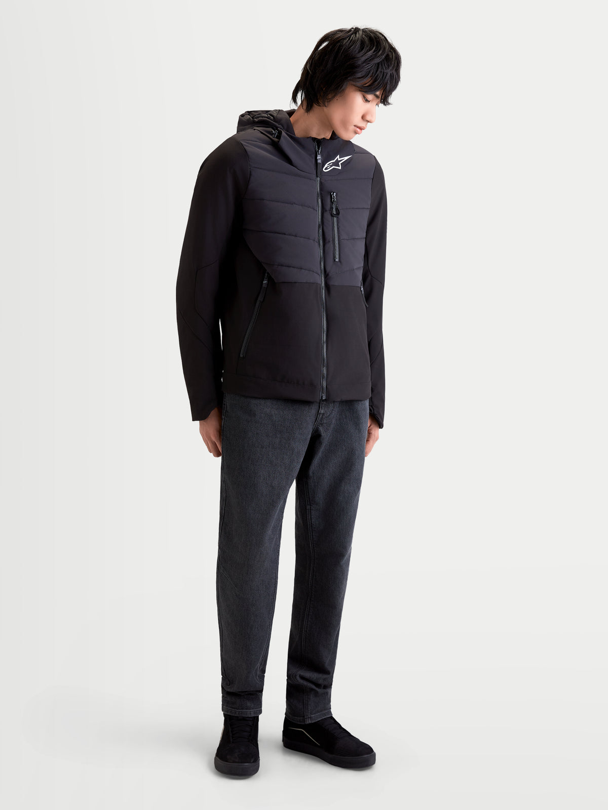 Alpinestars Therma-Tech Waterproof Jacket, men's urban contemporary motorcycle jacket in black, front view on a model wearing the insulated textile jacket with sonic-welded down construction and integrated hood system.