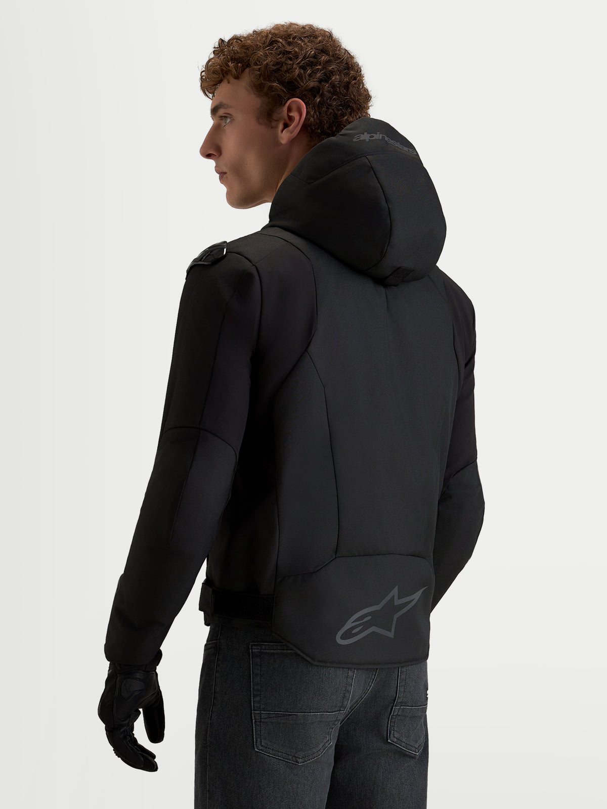 Alpinestars Zaca V2 Waterproof Jacket, Men's Black motorcycle jacket featuring an integrated hood, extended rear hem with Alpinestars logo, and Tech-Air ready construction