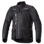 Alpinestars Bogota Pro Drystar Jacke, komplett schwarze Motorrad-Tourenjacke, graue und rote Akzente, große Belüftungspaneele an der Brust, wasserdichte Taschen mit roten Zuglaschen, hoher Schutzkragen, strapazierfähige Textilkonstruktion für Adventure-Fahrten
