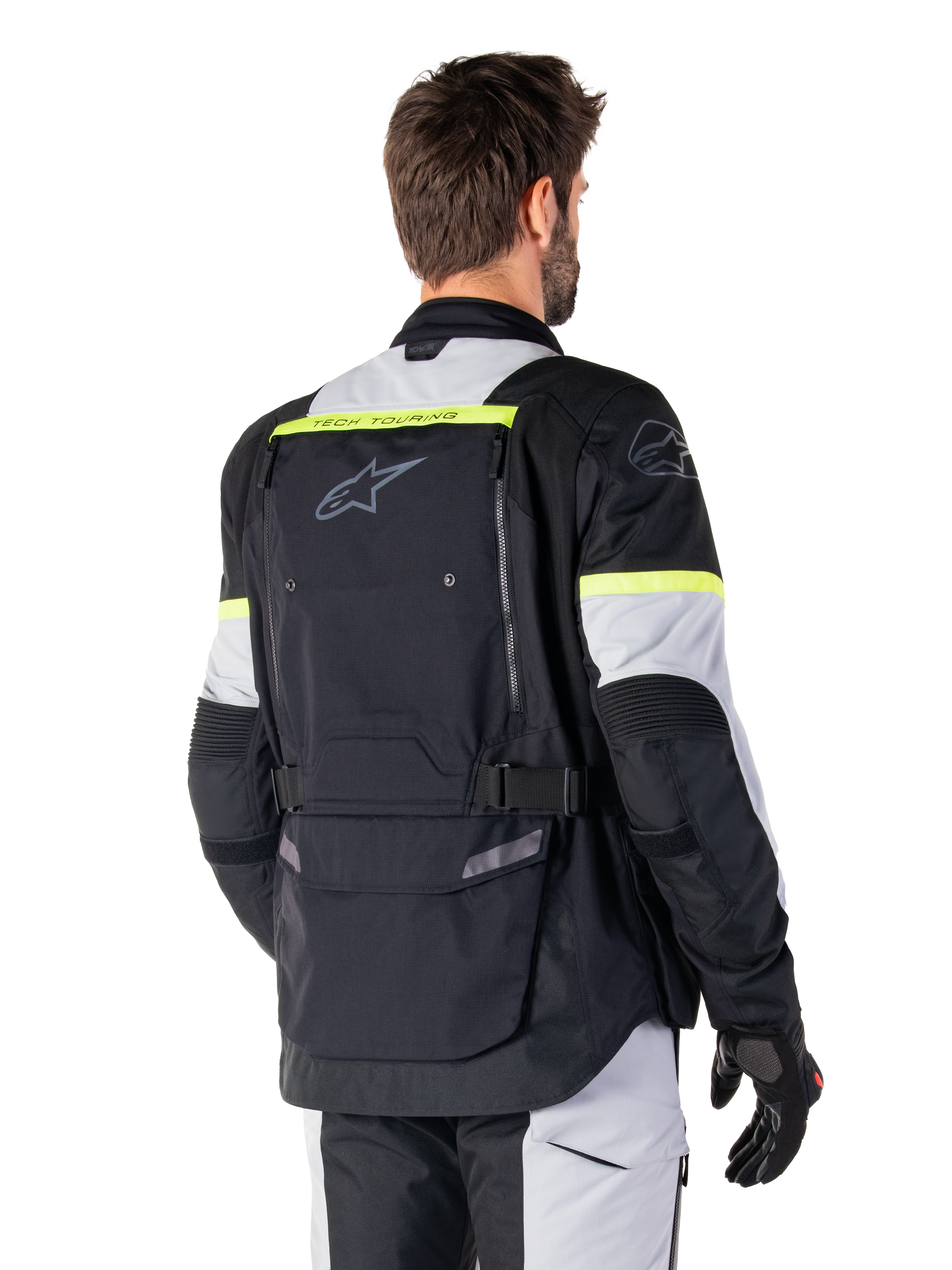 Alpinestars Bogotá Pro Drystar® Jacke, Adventure-Tourenjacke, Schwarz, Ice Gray und Gelb Fluo, Rückansicht mit großem Rückentaschen-Panel und „TECH TOURING“-Branding, Alpinestars-Logo und fluoreszierenden Akzenten, technische Textil-Fahrausrüstung