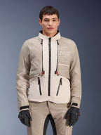 Alpinestars AMT-10LAB Drystar® XF Jacket, Adventure Motorcycle Jacket, White Sand Aluminum Camo, modular design with black zippers and red accents, worn with matching pants and black gloves, featuring Alpinestars Motion Technology branding on the chest, professional all-weather riding suit
