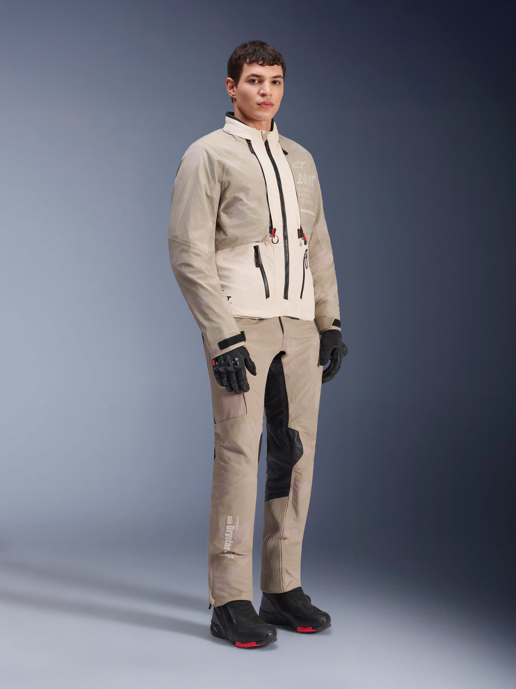 Alpinestars AMT-10LAB Drystar® XF Pants and matching jacket, Aluminum Camo adventure riding gear, complete outfit with black gloves and boots, featuring technical branding and modular protective panels, studio lifestyle shot