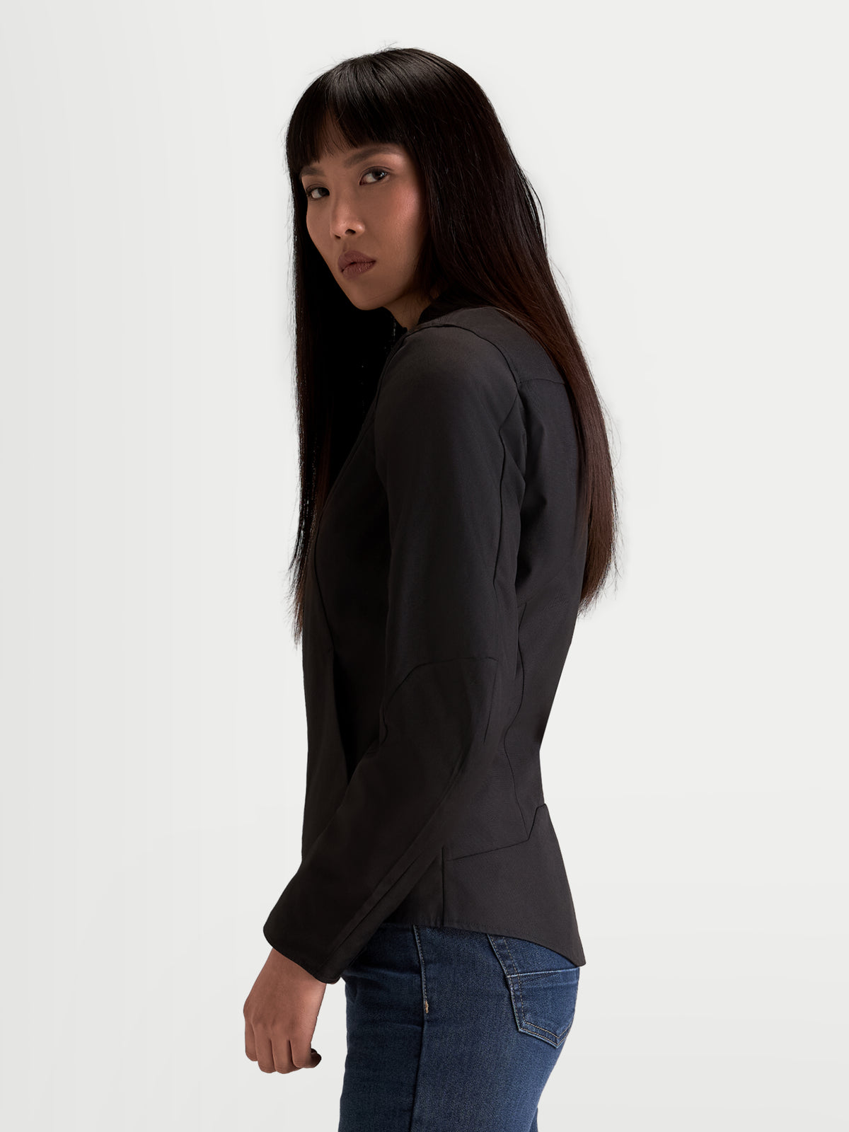 Alpinestars Stella C-1 Waterproof Jacket, women's urban motorcycle textile jacket in black, side profile view worn by a model with ergonomic sleeves and polyfabric construction.