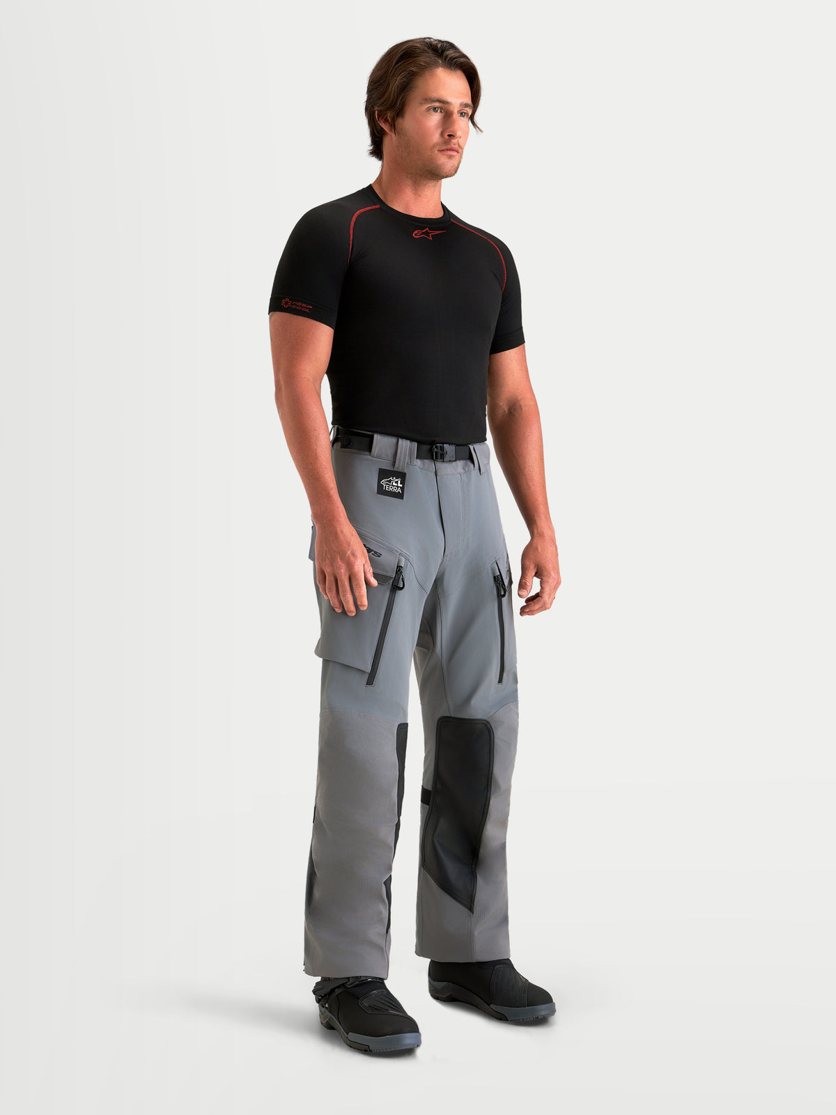 Alpinestars Maxdura Drystar XF Laminated Pants, Men's adventure motorcycle pants in Dark Gray and Black, waterproof textile riding gear with zippered thigh vents and protective knee panels worn by a model