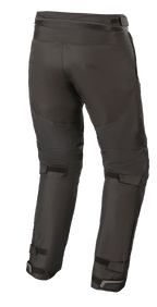 Alpinestars Raider V2 Drystar® Hose, Textil-Motorradhose, Schwarz, Rückansicht mit Verbindungsreißverschluss an der Taille und verstellbaren Klettverschlüssen an der Beinrückseite und den Knöcheln.