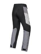 Alpinestars 2025 Honda Woman Stella ST-1 Waterproof Pants, Women's Motorcycle Touring Pants, Ice Gray Dark Gray and Black, rear three-quarter view showing durable textile construction, gray and black color-blocked panels, Honda branding on the hip, and adjustable ankle closures.