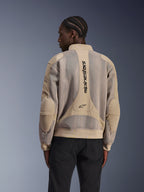 Alpinestars Flight Air Jacket, Urban Motorcycle Jacket, Tan, rear view featuring extended 3D mesh panels and vertical Alpinestars branding on the back, bomber-inspired design with ribbed hem, worn by model in black pants