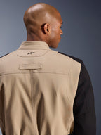 Alpinestars Dice Jacket, Urban Motorcycle Jacket, Tan and Black, close-up detail of the back collar and shoulder, featuring an embroidered logo, rugged polycotton twill construction, street-ready workwear style