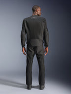 Rear view of a man wearing the Alpinestars C-1 Air Jacket in Black, urban motorcycle jacket with tech mesh panels, matching black textile pants and boots, clean aesthetic with reflective logo on the upper back.