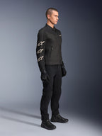 Alpinestars T-Dyno Air Jacket, Black, textile motorcycle jacket, featuring three white Alpinestars logos on the sleeve, worn with matching black pants and gloves, urban riding gear with breathable mesh panels