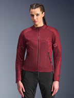 Alpinestars Stella C-1 Air Jacket, Women's Motorcycle Jacket, Burgundy Red, mesh panels for airflow, zippered front and pockets, fitted sporty design, worn by a model with black riding pants